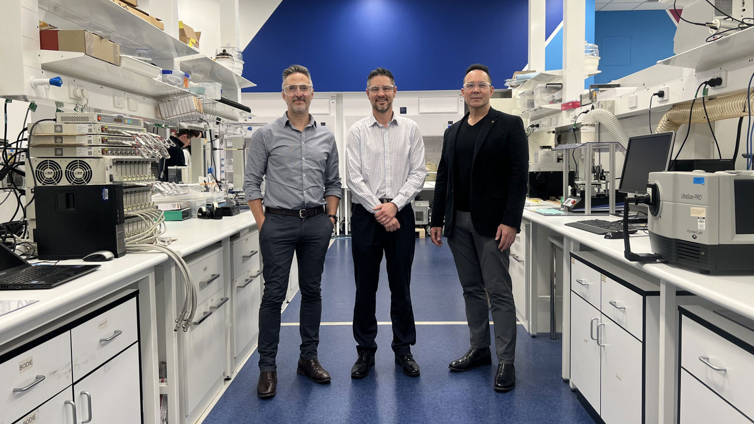 people posing for a photo in a lab 