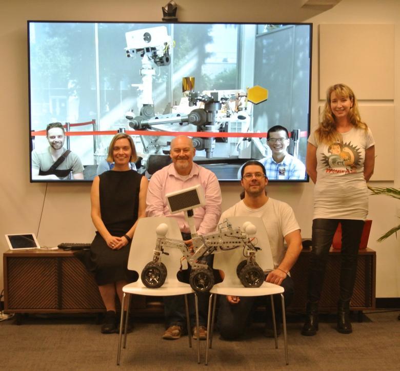 The Akin team, in Australia and USA, appear in both person and virtually. Both sides of video call are displaying their robots