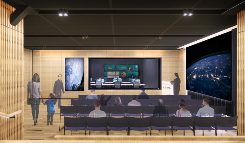 An artist impression of mission control shows a theatrette with light timber panelling and a dark ceiling. A presenter is standing before people seated in rows of chairs, a man is entering the room, and a woman with a child is leaving it.