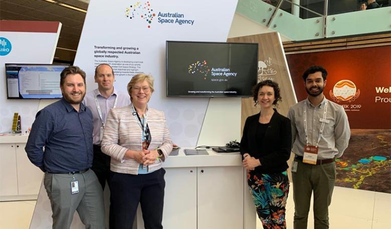 Photo of Australian Space Agency officials at their exhibition stand.