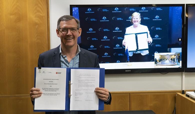 Chief Minister of the Northern Territory Hon Michael Gunner and Dr Megan Clark AC present signed agreement