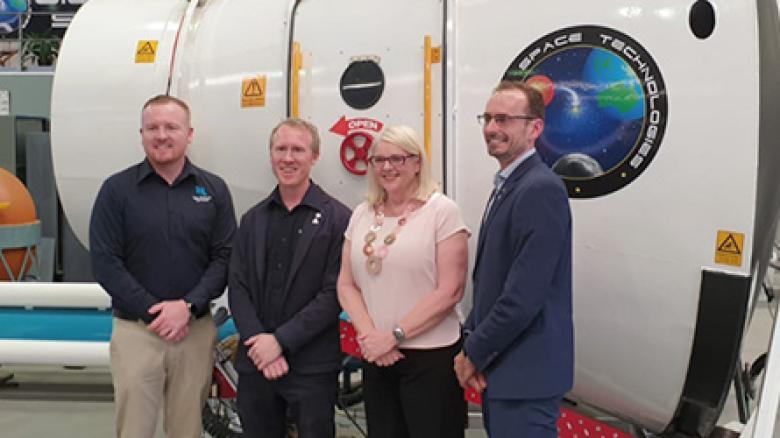 James Gilmour and Adam Gilmour, Gilmour Space; Minister Karen Andrews; Anthony Murfett, Deputy Head Australian Space Agency stand in front of space capsule