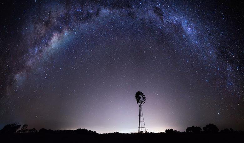 Purple night sky with stars showing the Milky Way from outback Australia. 