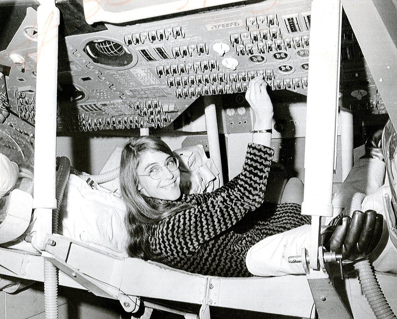 A woman working on space equipment