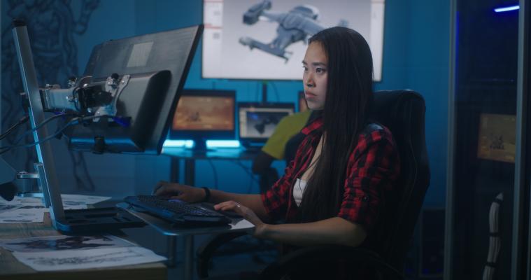 Person sitting at desktop computer