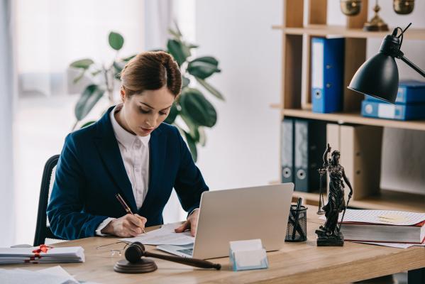 Space lawyer working at desk