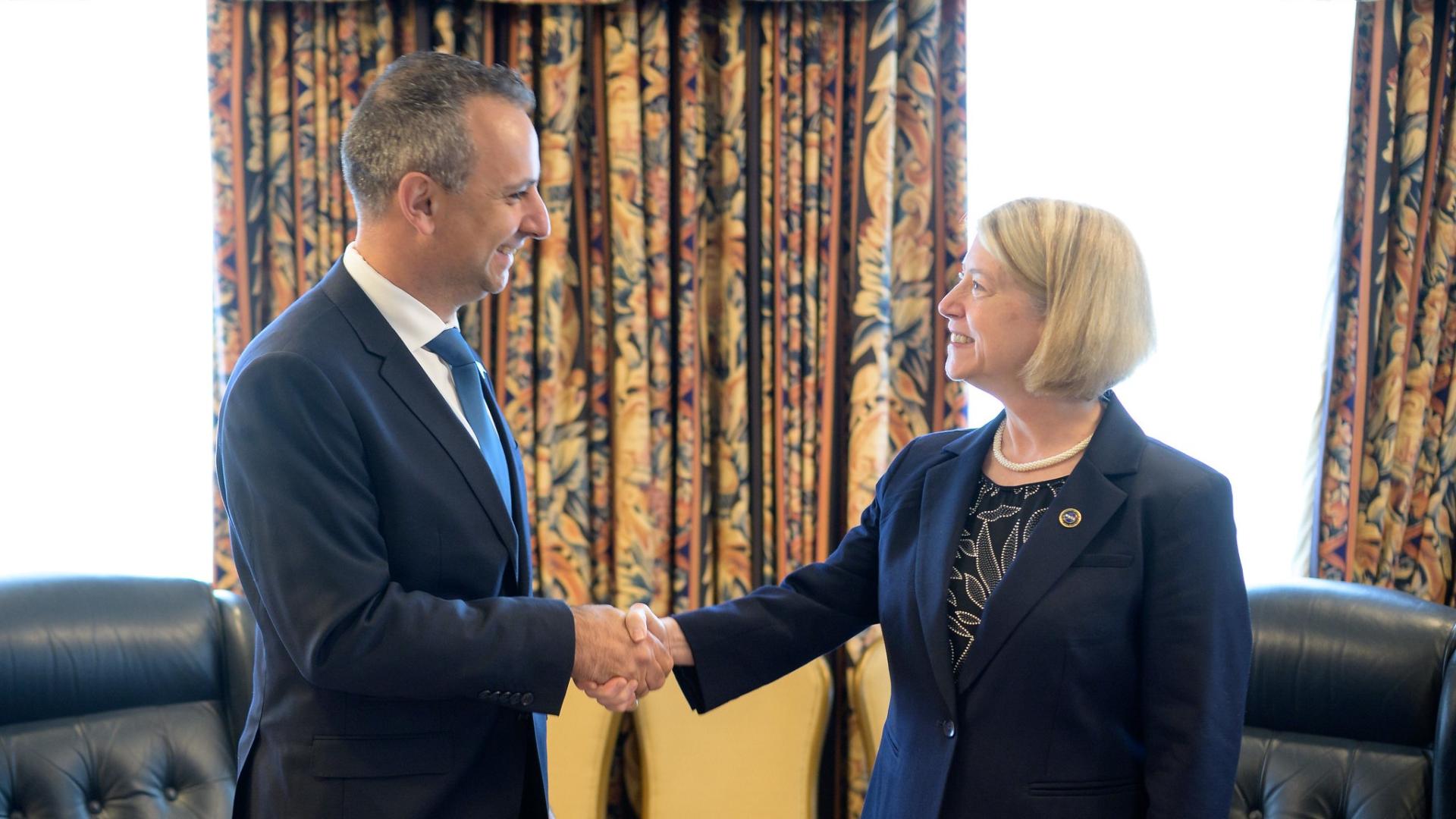 two people shaking hands after an agreement