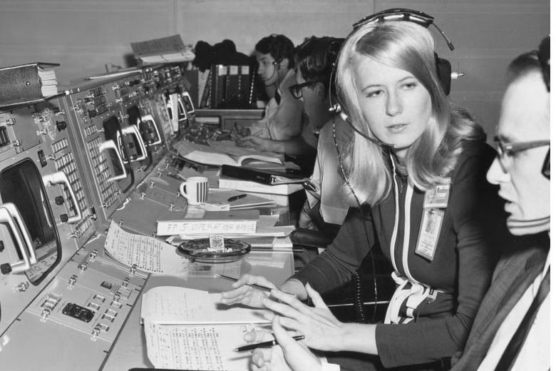 A woman working on space equipment