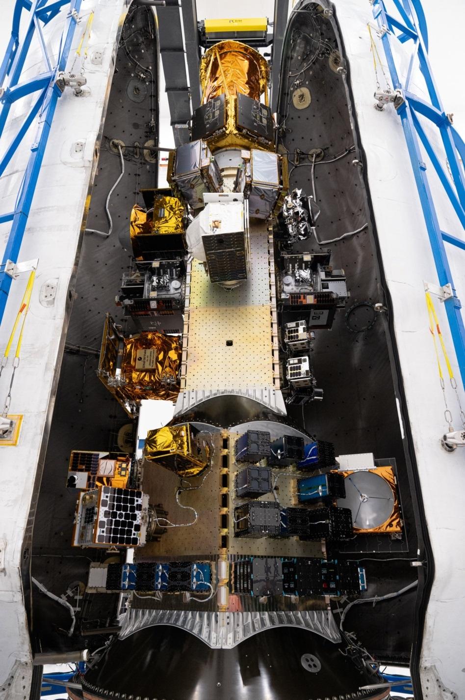 The interior of a rocket filled with space technologies that will be deployed in orbit.